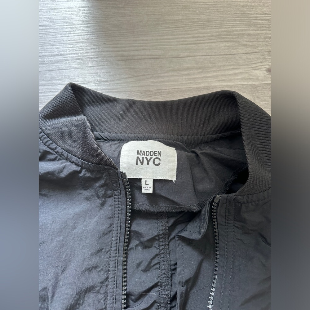 Black sporty windbreaker